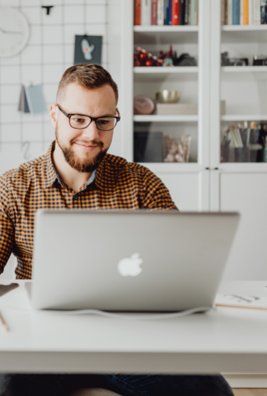 man-on-laptop-in-kitchen